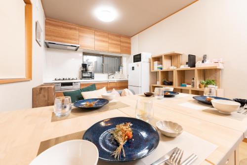 a kitchen with a table with a plate of food on it at YUKIMARU in in Tokyo