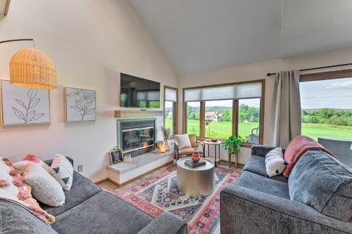 a living room with a couch and a fireplace at The Golf View, boutique Galena getaway! in Galena