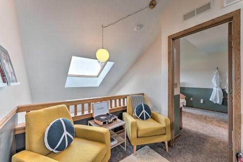 a living room with two chairs and a mirror at The Golf View, boutique Galena getaway! in Galena