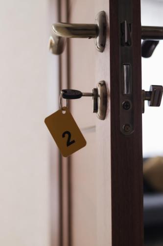 a lock on a door with a question mark on it at Готель Хутір in Malyye Khutora