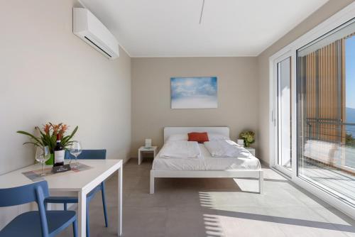 Ένα ή περισσότερα κρεβάτια σε δωμάτιο στο Residence Conca Verde with pool