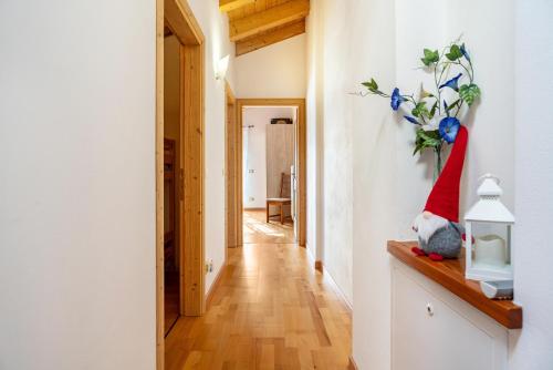 a hallway with a santa hat on a shelf at Maso Gigi in Castel Ivano