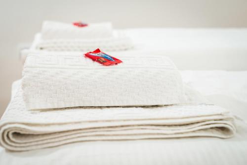 a stack of white towels sitting on a table at Rooms Lidija in Zagreb