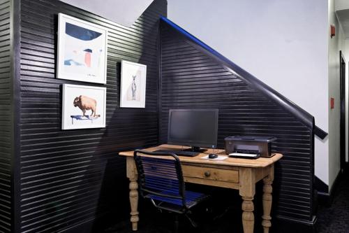 an office with a desk with a computer on it at Independence Square 310, Chic, Remodeled Studio w/ Great Location in Aspen, A/C, & Kitchenette in Aspen