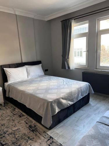 a bedroom with a large bed and a window at 9 Otel Samsun in Kalkanlı