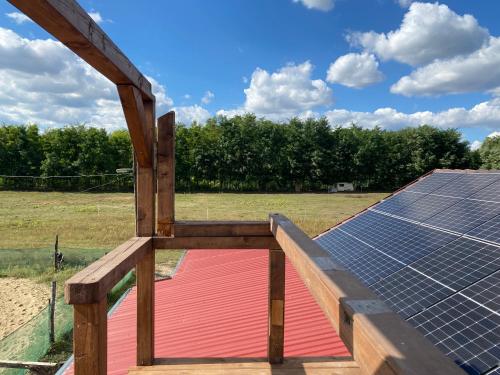 a roof with solar panels on top of it at Tündér Pension in Mogyoród