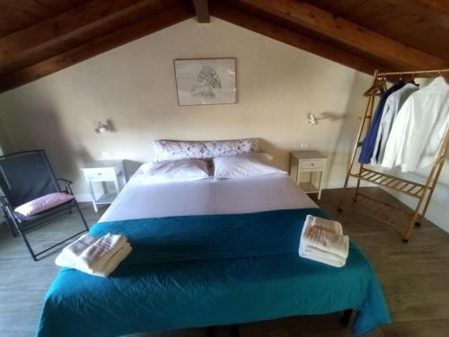 a bedroom with a large bed in a attic at B&B dal Cardinale in Ozieri