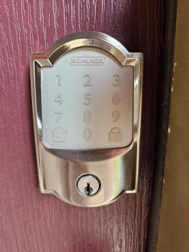 a door with a lock on a wooden door at Elizabeth Experiences in Atlanta