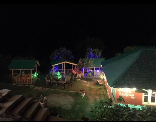 a view of a house at night with lights at Renuka homestay and cafe in Kasol