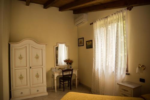 Katil atau katil-katil dalam bilik di Agriturismo Mandrola