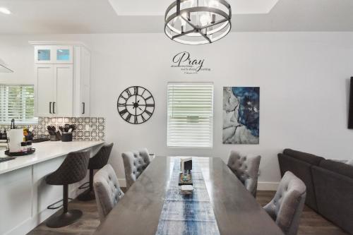 a kitchen and dining room with a wooden table and chairs at Tranquil Oasis near Canyon Lake home in Spring Branch