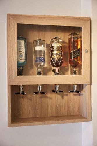 a wooden cabinet with four differentiatesiatesiatesiatesiatesiatesiatesiatesiatesiates at Riu Palace Macao - Adults Only - All Inclusive in Punta Cana