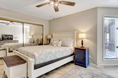 a bedroom with a bed and a window at Lakefront Hot Springs Condo with Pool Access! in Hot Springs