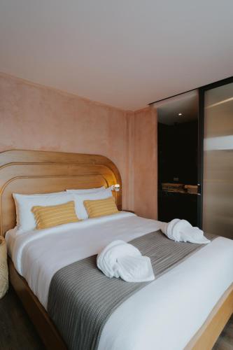 Ένα ή περισσότερα κρεβάτια σε δωμάτιο στο Hotel Clay Chiang Mai