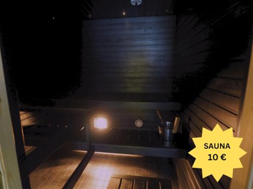a view of a sauna at night with a light at Renkomäki in Lahti
