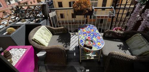 a snowboard is sitting on a table on a balcony at Casale D' Or in Palermo