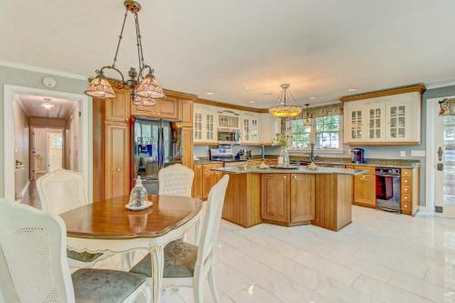 a kitchen with wooden cabinets and a table and chairs at Bella Rosa Country Estate in Goodlettsville