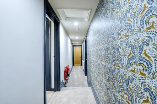 a hallway with a blue and white wall at The Royal in Wallingford