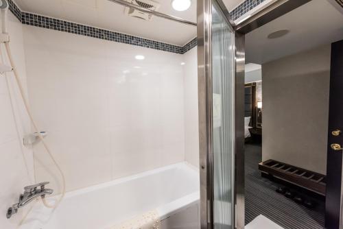 a bathroom with a sink and a mirror at Hub Hotel - Zhongshan Branch in Taipei