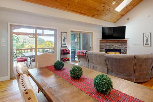 a living room with a couch and a table at Sky Reach at Beech in Beech Mountain