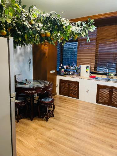 a kitchen with a table with oranges on it at Private rooms in Phatumwan Chula near Samyan, Chinatown, Jay-o Siam center, Central world middle of Bangkok in Bangkok