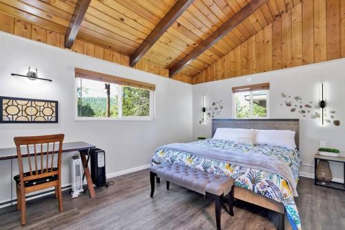a bedroom with a bed and a wooden ceiling at Ursa Major- Ultra Modern Resort Duplex- in Big Bear Lake