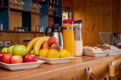 a counter with plates of fruit on it at Wanderlust José Ignacio in José Ignacio