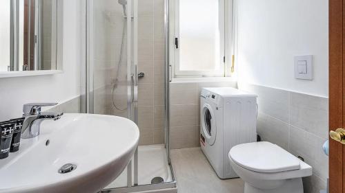 a bathroom with a sink and a toilet and a shower at Blue City Paradise - Renovated APT in center Milan in Milan