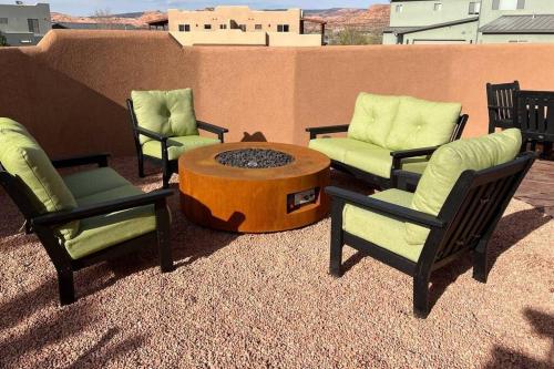 a group of chairs and a coffee table on a patio at Gorgeous Moab Retreat in Moab