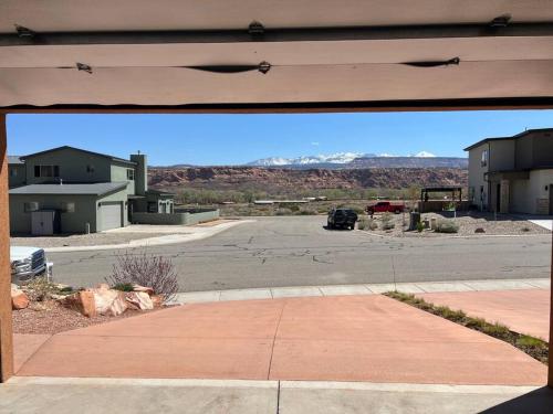 a view of a parking lot from an open garage at Gorgeous Moab Retreat in Moab