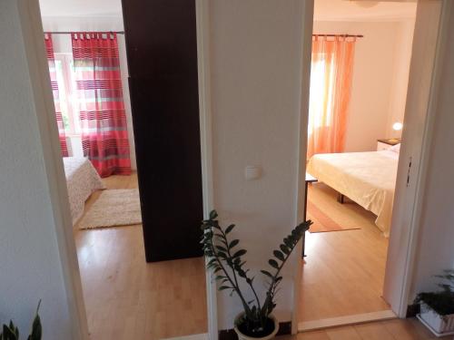 Ένα ή περισσότερα κρεβάτια σε δωμάτιο στο Apartments Biočić