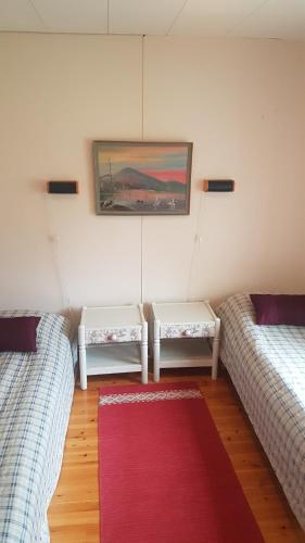 Postel nebo postele na pokoji v ubytování Wanha Kaivoskylä Mainari Oy