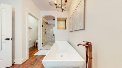 a bathroom with a large white sink in a room at Wind River Oasis in Kalispell