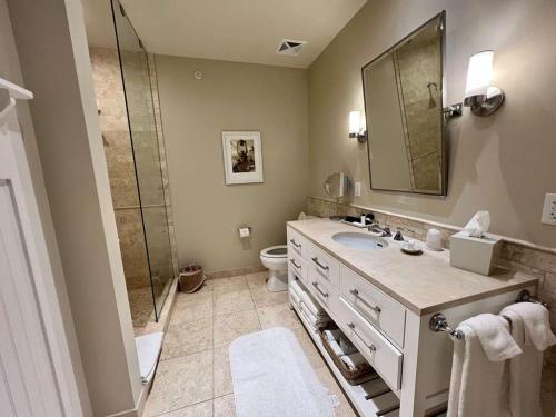 a bathroom with a sink and a shower at Sanderling Resort Residences in Duck