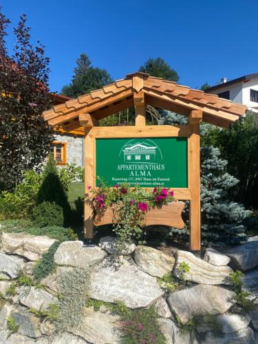 a sign for the american pavilion at a garden at Chalet Alma in Haus im Ennstal