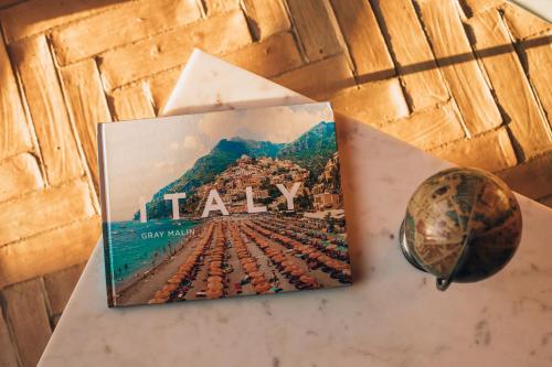 a book sitting on top of a table next to a ball at Borgo San Vincenzo in Montepulciano