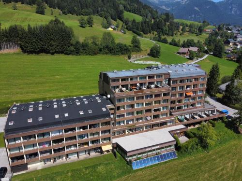 an aerial view of a hotel in a green field at Cosy Apartment in Tauplitz