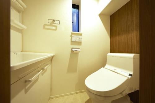 a bathroom with a white toilet and a sink at Maruka Osaki Room C - Vacation STAY 53141v in Tokyo