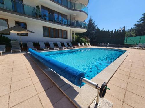 a swimming pool in front of a building at Kristoff Plaza in Trenčín