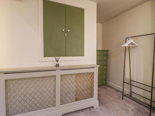a dressing room with a mirror and a dresser at 20 Wool Road in Oldham