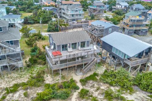 an aerial view of a house with houses at Kinnakeet Dunes in Avon