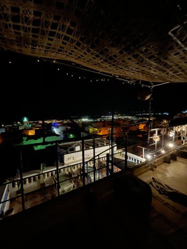 a view of a train station at night at Tamraght White Hostel in Tamraght Ouzdar