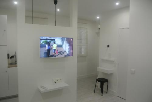 a white room with a tv on a wall at Chabanon in Marseille