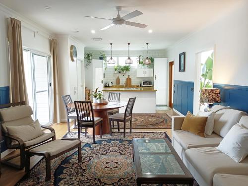 a living room with a couch and a table at The Old Church Maleny in Maleny