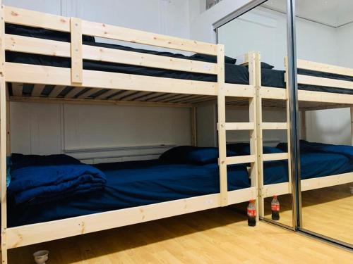a couple of bunk beds in a room at We are in this together in Santa Ana