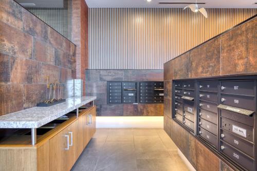 a large wine cellar with wooden cabinets and a counter at Potomac Yard 1br w rooftop gym nr metro WDC-714 in Alexandria
