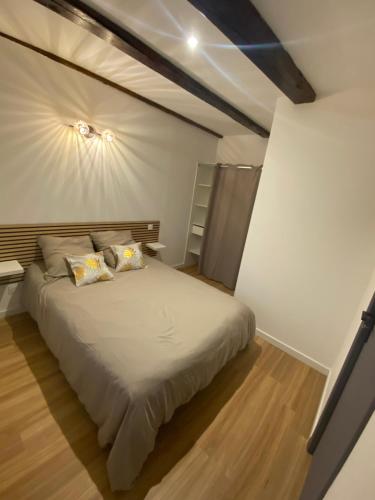 a bedroom with a large bed in a room at La bulle Aveyronnaise in Lapanouse