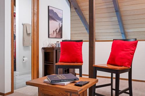 a room with two red pillows and a table at No Dog Fees - Dog Friendly 3BR 2BA with Loft and Mountain Views - Near Bryce Resort in Basye, VA in Basye