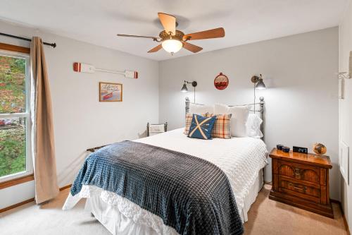 a bedroom with a bed and a ceiling fan at No Dog Fees - Dog Friendly 3BR 2BA with Loft and Mountain Views - Near Bryce Resort in Basye, VA in Basye
