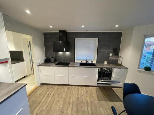 a kitchen with a sink and a counter top at Noah Longstay Liljanstorpsvägen in Västerås
